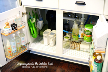 use hooks to organize under sink - DIYscoop.com